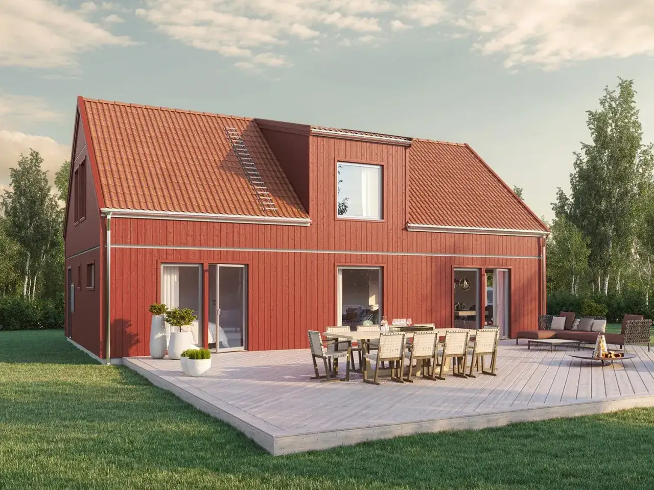 Rött trähus med tegeltak och en stor takkupa. Trädäck med matgrupp och soffgrupp framför huset.