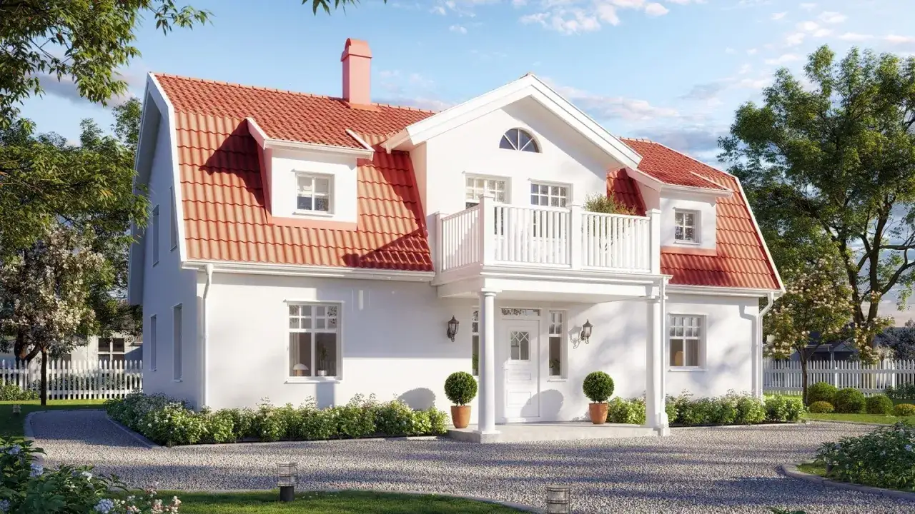Vitt hus med rött, brutet tak, balkong och trädgård.
